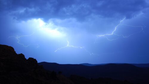 Stunning Lightning Strike Over Dark Mountain Peaks 4K PC Wallpaper