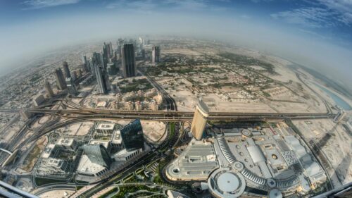 Stunning Aerial Fisheye View of Dubai Cityscape and Skyscrapers 4K Wallpaper