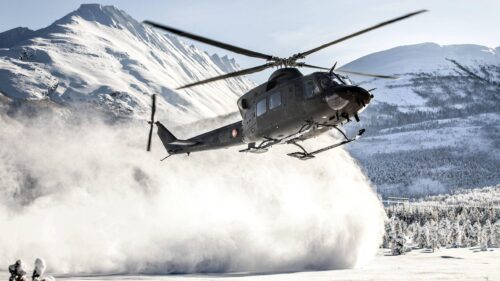 Military Helicopter Landing in Snowy Mountains 4K Wallpaper