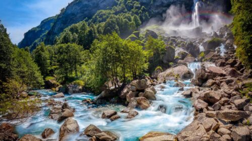 Breathtaking Mountain Waterfall with Rainbow and River Stream 4K Wallpaper