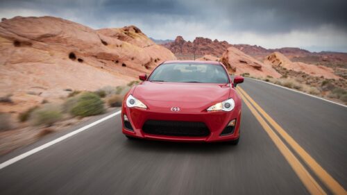 Stunning Red Scion FR-S Driving on a Scenic Desert Highway PC Wallpaper