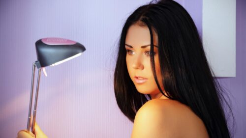 Beautiful Young Woman Illuminated by Desk Lamp Soft Lighting PC Wallpaper