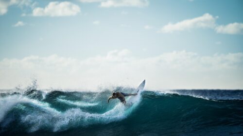 Professional Surfer Riding Epic Ocean Wave Desktop Wallpaper