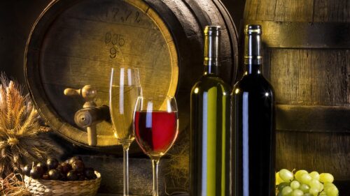 Rustic Wine Cellar with Bottles and Oak Barrels 4K PC Wallpaper