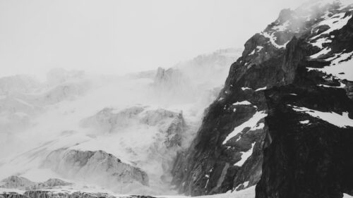 Dramatic Snowy Mountain Peak in Black and White Desktop Wallpaper