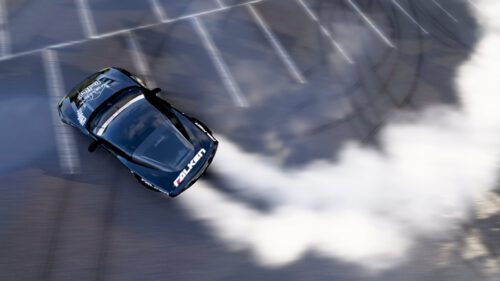 Black Red Bull Drift Car Smoking Tires Aerial View 4K Wallpaper