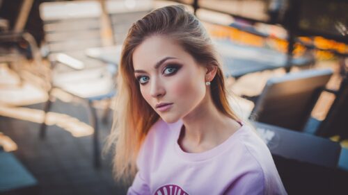 Stunning Portrait of a Young Woman with Piercing Eyes Desktop Wallpaper