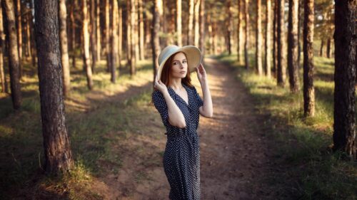 Beautiful Redhead Woman in Polka Dot Dress Walking in Pine Forest PC Wallpaper