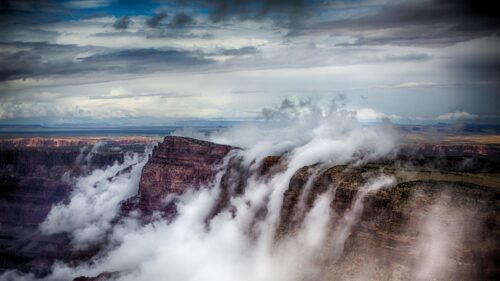 Breathtaking Grand Canyon Mist and Dramatic Clouds Landscape PC Wallpaper