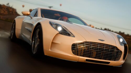Elegant Aston Martin One-77 Driving at Sunset PC Wallpaper