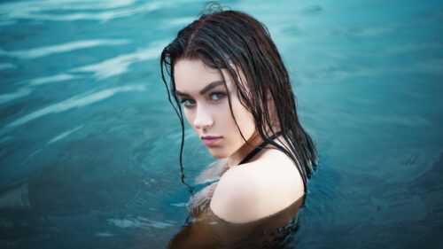 Stunning Portrait of a Woman with Wet Hair in Turquoise Water PC Wallpaper
