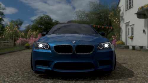 Stunning Blue BMW M5 Sedan Front View Desktop Wallpaper