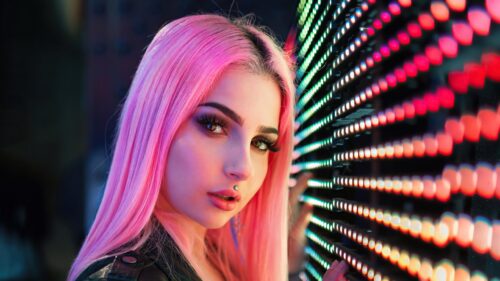 Stunning Cyberpunk Portrait of a Girl with Pink Hair and Neon Lights PC Wallpaper