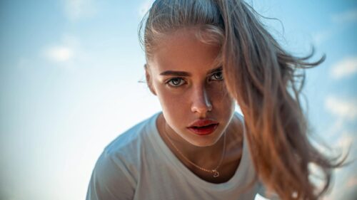 Stunning Portrait of a Young Woman with Blue Eyes Desktop Wallpaper