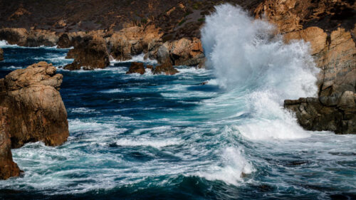 Powerful Crashing Waves Against Rugged Coastal Cliffs Desktop Wallpaper