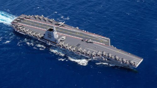 Modern Aircraft Carrier Sailing on Open Ocean PC Wallpaper
