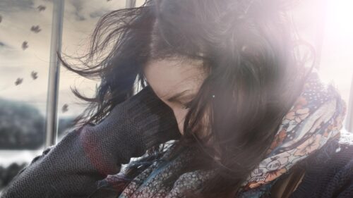 Melancholic Girl with Windblown Hair Cinematic Portrait PC Wallpaper