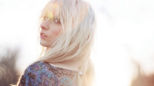 Stunning Blonde Woman with Ethereal Backlit Glow Desktop Wallpaper