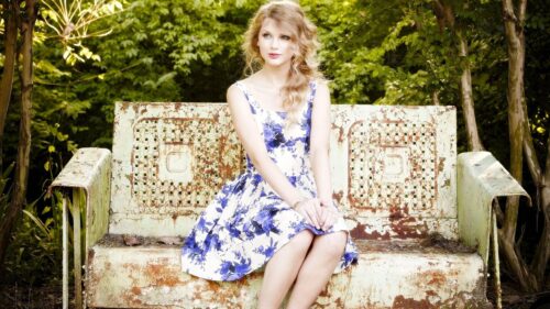 Taylor Swift Floral Dress on Vintage Garden Bench Desktop Wallpaper