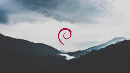 Minimalist Debian Linux Logo Over Misty Mountain Landscape PC Wallpaper