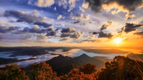 Breathtaking Mountain Sunrise Above Sea of Clouds 4K Desktop Wallpaper