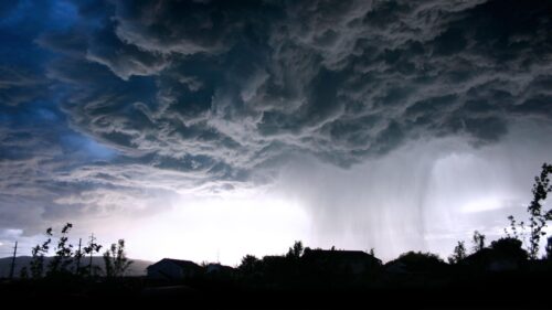 Dramatic Storm Clouds Over Suburban Landscape 4K Wallpaper