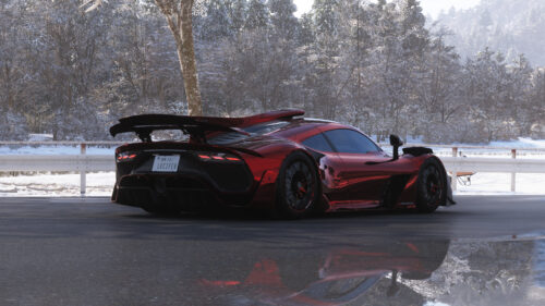 Stunning Metallic Red Mercedes AMG One in Snowy Winter Landscape 4K Wallpaper