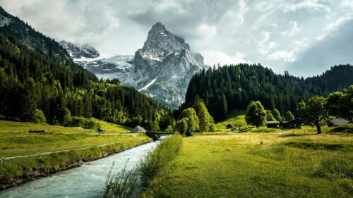Majestic Swiss Alps Mountain Landscape with River and Forest 4K Wallpaper