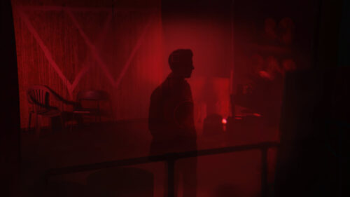 Mysterious Man Silhouette in Crimson Red Haze 4K Desktop Wallpaper