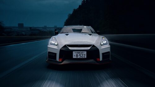 White Nissan GT-R R35 Nismo Racing on Highway at Night 4K Wallpaper