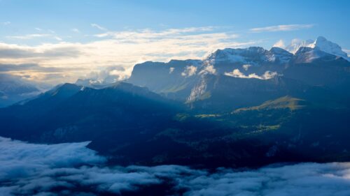 Breathtaking Swiss Alps Mountain Peaks Above The Clouds 4K Wallpaper