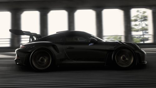 Sleek Black Porsche 911 GT3 RS Driving at Speed Desktop Wallpaper