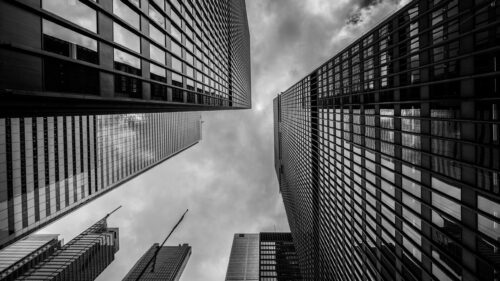 Low Angle View of Modern Skyscrapers Against Dramatic Cloudy Sky PC Wallpaper