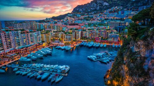 Stunning Sunset View of Monaco Harbor and Luxury Yachts 4K Wallpaper