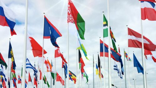 Global Unity International Flags Waving in the Sky 4K Wallpaper