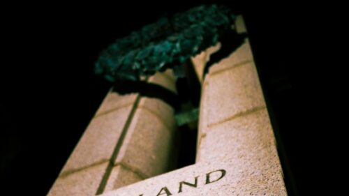 Low Angle View of Stone Monument and Bronze Wreath 4K Wallpaper