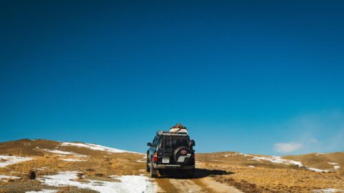 Toyota Land Cruiser Off-Road Adventure in Snowy Mountains 4K Wallpaper