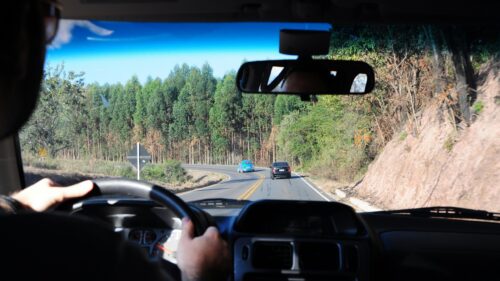 Road Trip Perspective Driving a Car on a Scenic Highway 4K Wallpaper