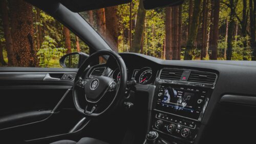 Volkswagen Golf Interior Driving Through Forest Landscape 4K Wallpaper