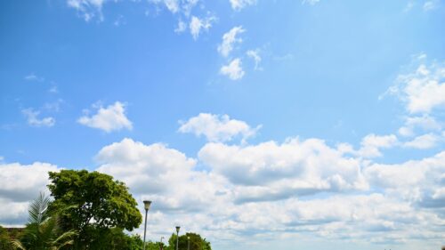 Bright Sunny Blue Sky with Fluffy White Clouds Desktop Wallpaper
