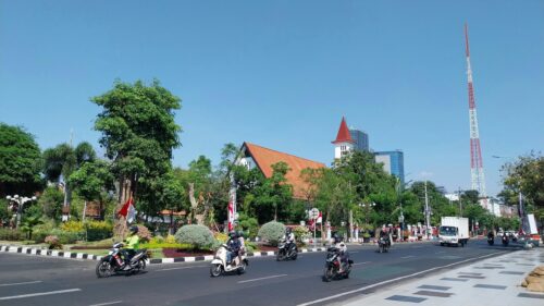 Sunny Streets of Surabaya City with Landmark Church Desktop Wallpaper