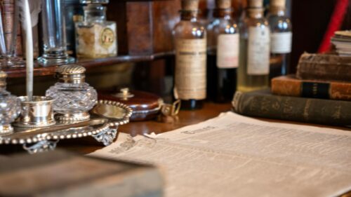 Vintage Writing Desk with Inkwell and Antique Newspaper 4K Wallpaper