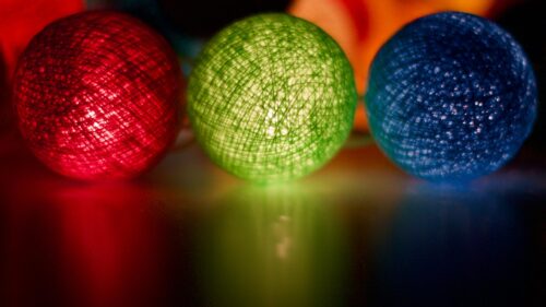 Vibrant Red Green and Blue Glowing Thread Ball Lights Desktop Wallpaper