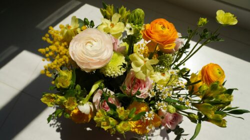 Stunning Floral Bouquet with Vibrant Ranunculus and Roses 4K Wallpaper