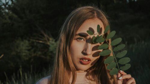 Enigmatic Woman with Leaf Shadow Aesthetic 4K Desktop Wallpaper