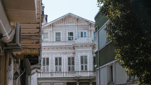 Vintage Pale Blue Mansion Architecture Street View 4K Wallpaper