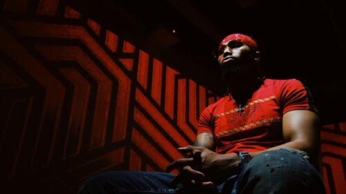 Stylish Man in Red Headband and T-Shirt Cinematic Portrait 4K Wallpaper