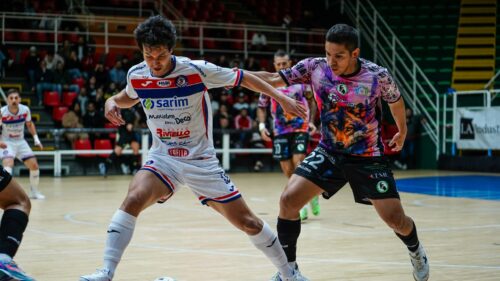 Professional Futsal Match Intense Duel Action Desktop Wallpaper