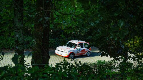 Nissan Micra Rally Car on Cobblestone Road 4K Desktop Wallpaper