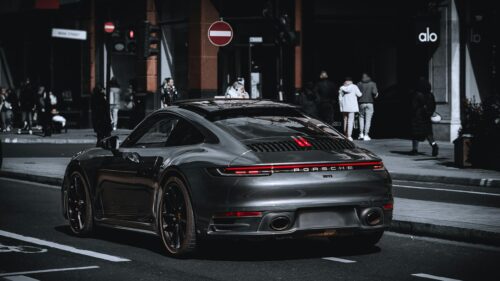 Sleek Dark Grey Porsche 911 Sports Car Street View 4K Wallpaper